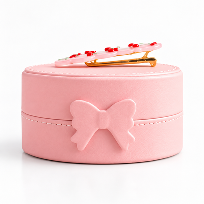 Boîte à bijoux enfant rose avec nœud sur le devant