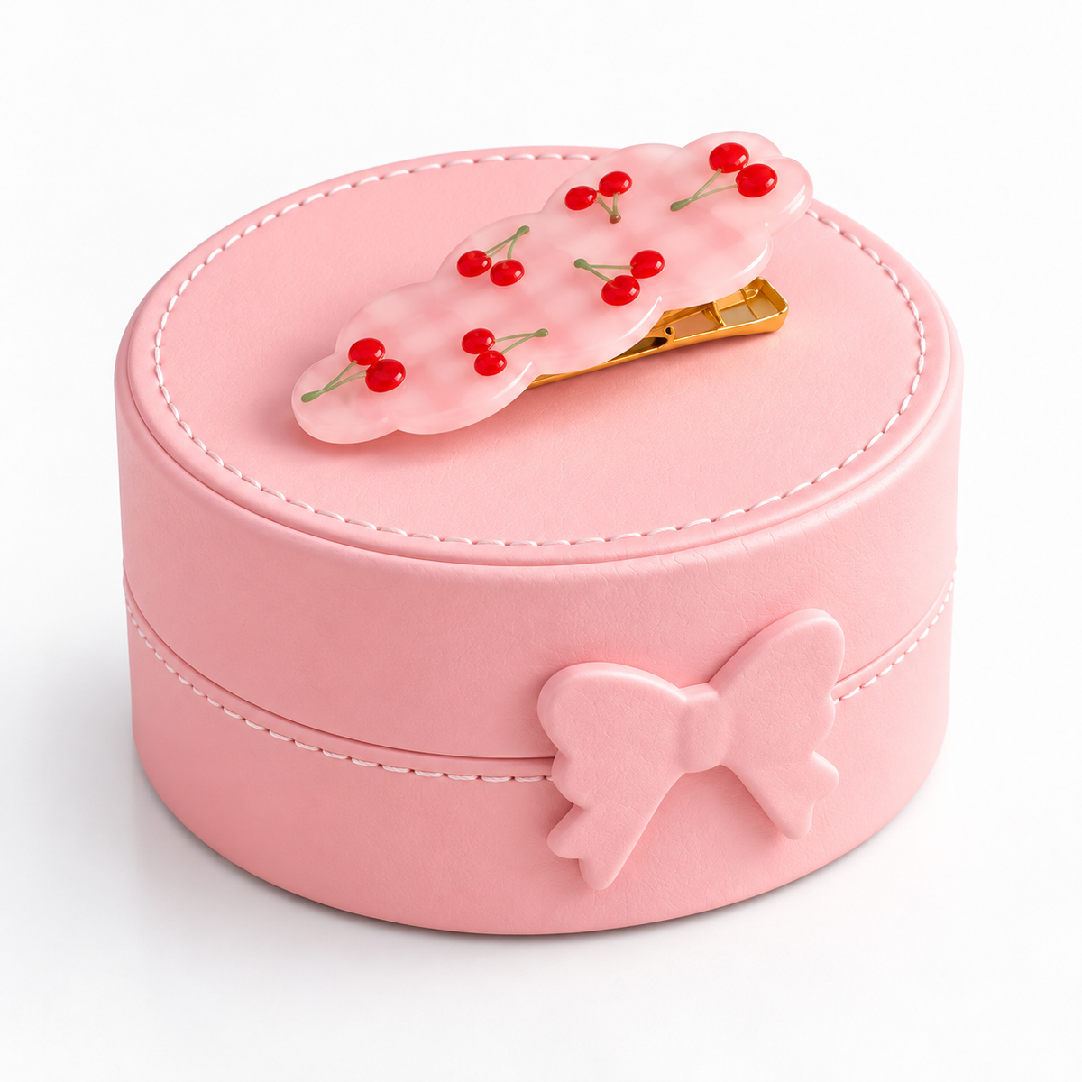 Boîte à bijoux ronde rose fermée avec décoration fantaisie