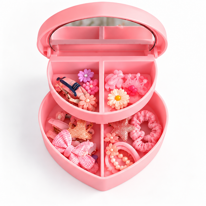 Boîte à bijoux cœur rose ouverte avec accessoires dans les compartiments